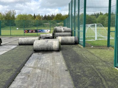 Rolls of artificial turf waiting to be taken off site for recycling.